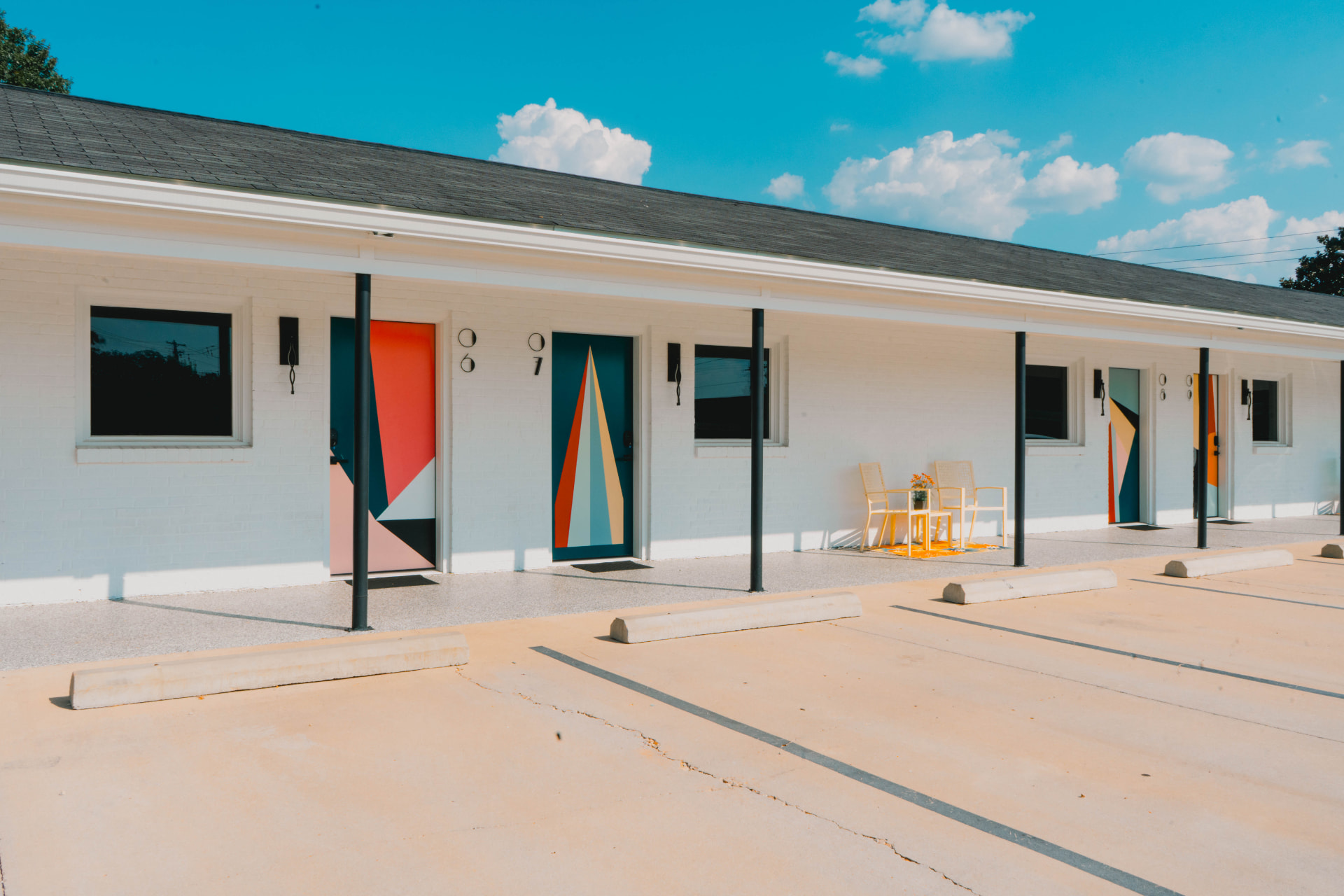 Guest room doors painted with bold geometric murals